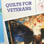 Quilts for Veterans title displayed above a patriotic bald eagle quilt design.